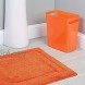 mDesign Soft Microfiber Polyester Non-Slip Rectangular Spa Mat Plush Water Absorbent Accent Rug for Bathroom Vanity Bathtub Shower Machine Washable 34 x 21 Orange